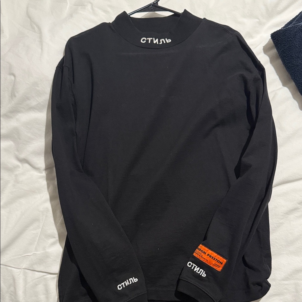 Heron Preston Black Long Sleeve Tee with White Cyrillic Logo and Orange Patch